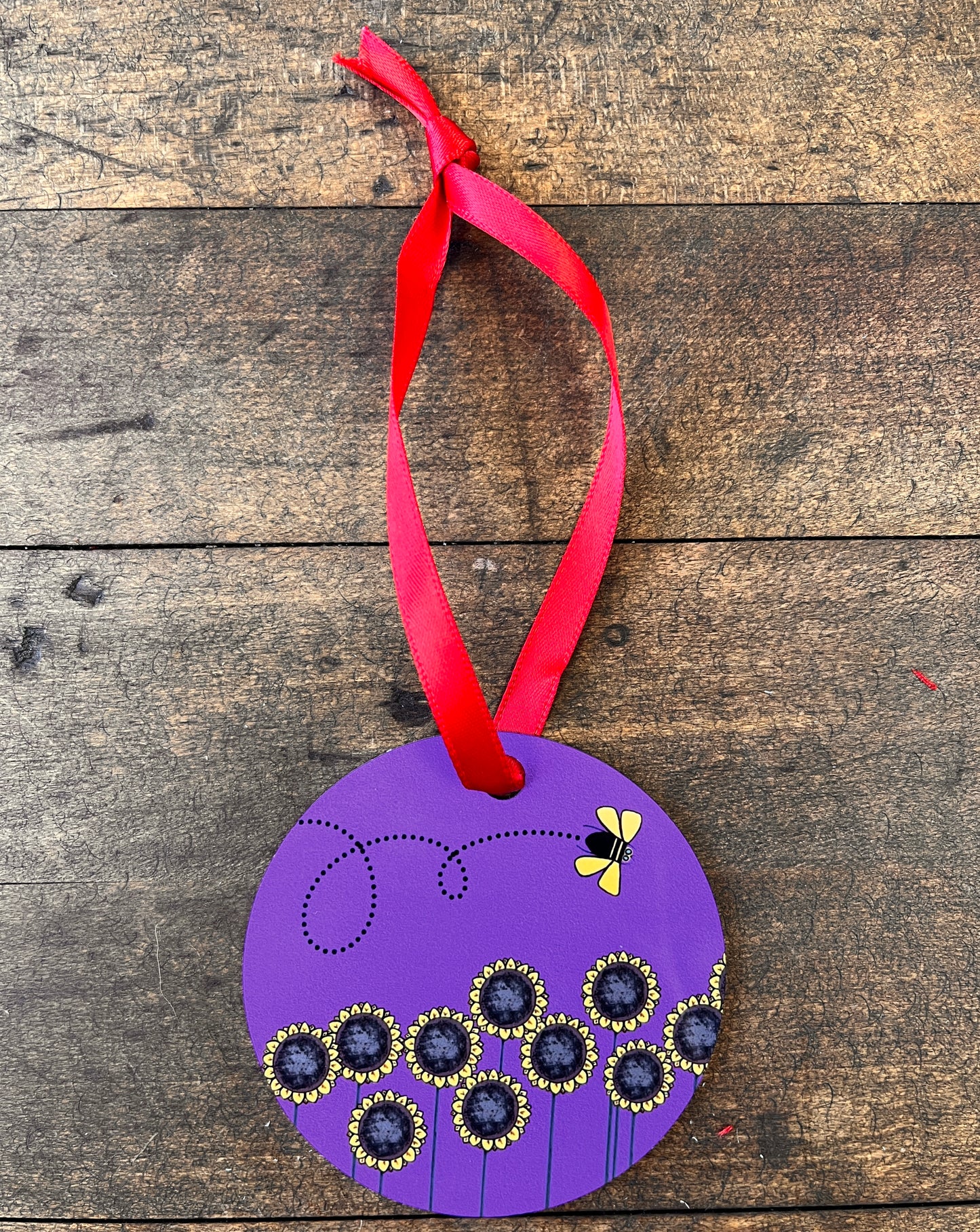Ornament-Round Metal Yellow Bee & Sunflowers With Purple Background.